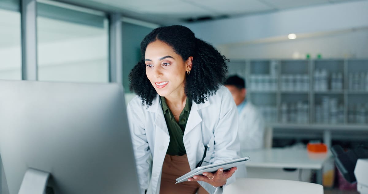 A licensed clinician reviewing a patient plan on screen