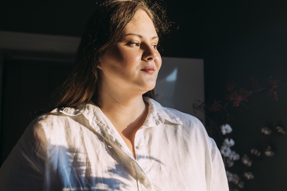Woman in soft natural light at home