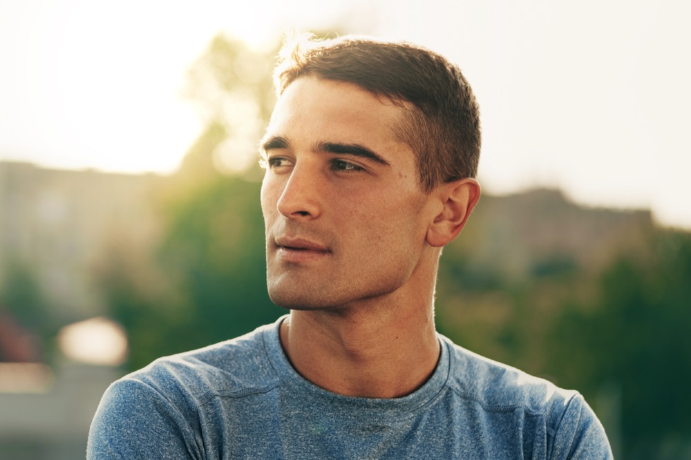 Man outdoors in golden-hour light